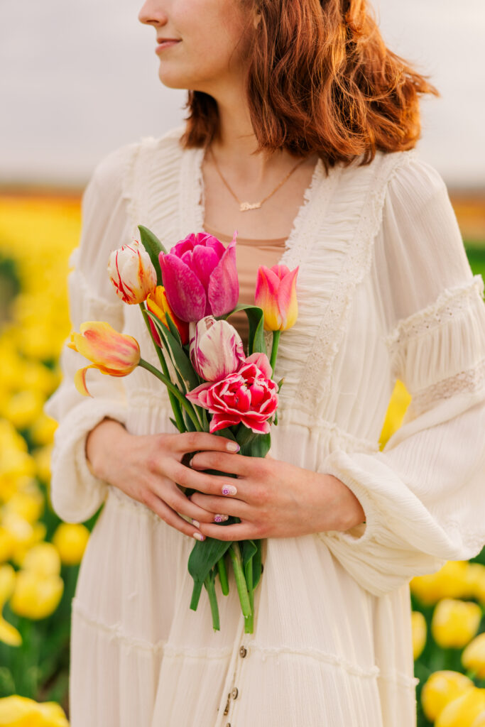 Senior girl with flowers for prop in photo session